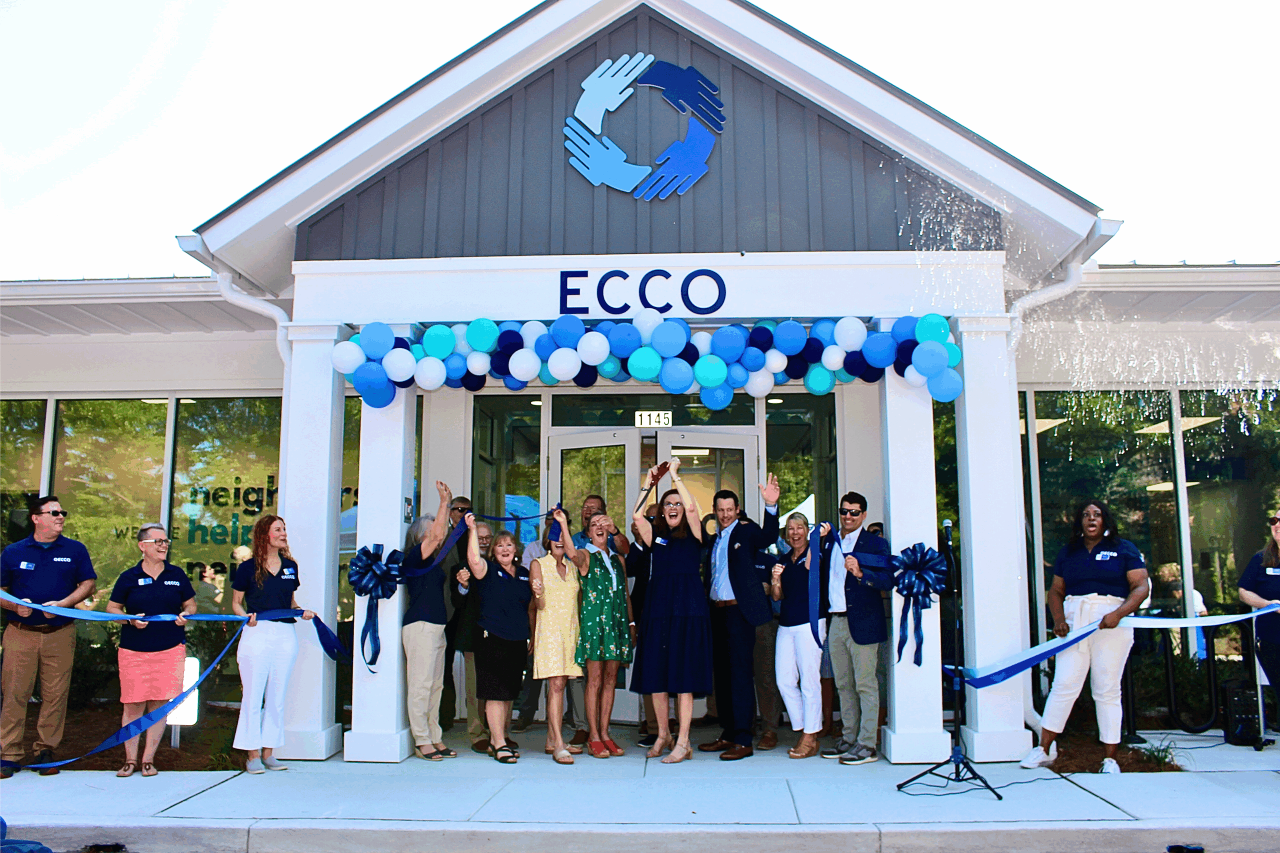 East Cooper Community Outreach celebrating outside their renovated facility.